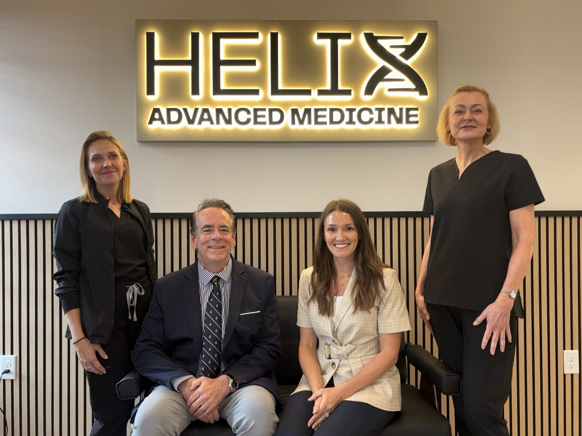 The Helix Advanced Medicine team under the practice sign
